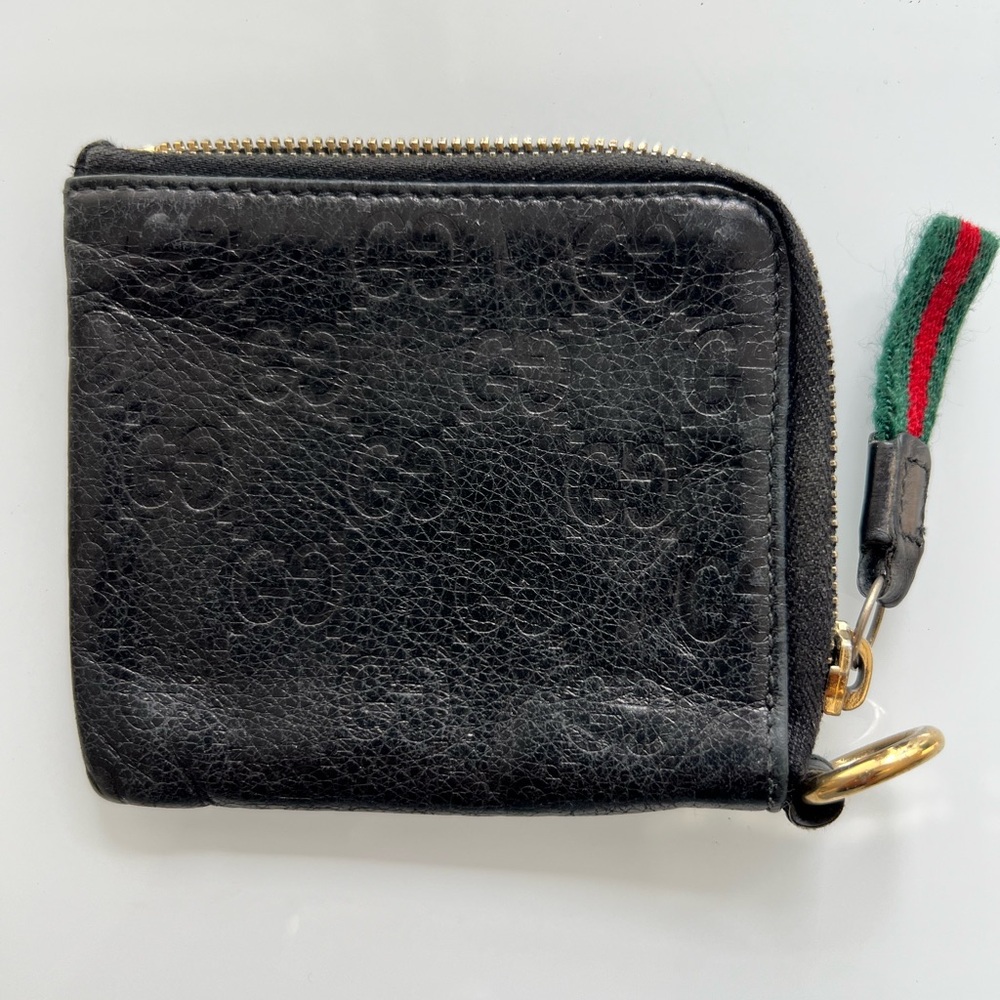 Gucci Black Guccissima Leather wristlet.